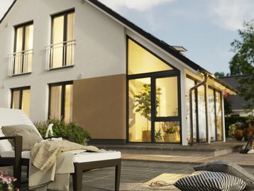 Einfamilienhaus Bodensee 129 mit Wintergarten und großzügiger Terrasse, fotografiert aus dem Garten