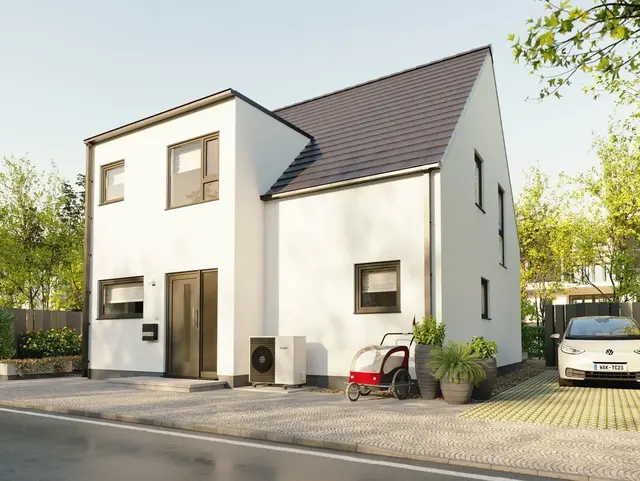Großzügiges Einfamilienhaus mit Panoramaanbau und großen Fensterflächen als Symbol für modernes Wohnen und den Weg ins Eigenheim.